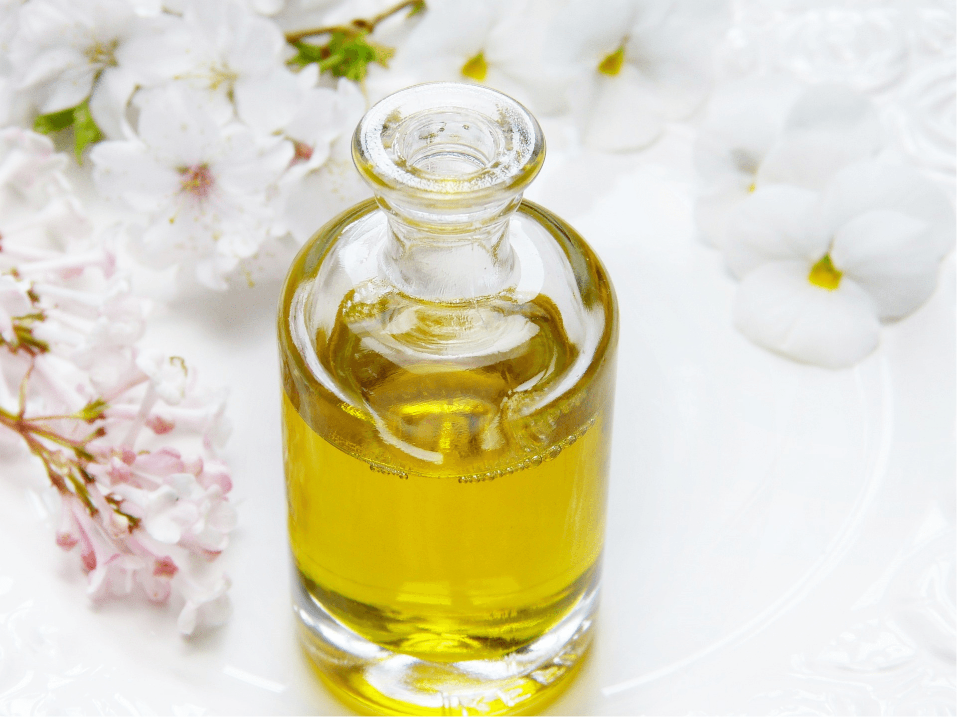 a glass bottle of organic coconut oil